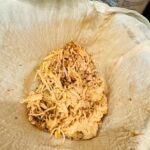 Shredded cooked food in cheese cloth