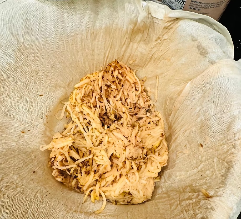 Shredded cooked food in cheese cloth