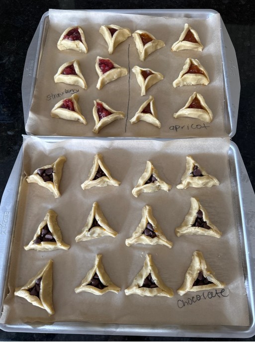Baking trays with filled pastries