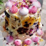 Colorful floral decorated cake on display